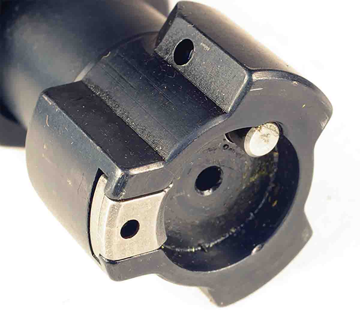 The three-lug bolt has a sliding tab extractor on the face of one of the lugs.